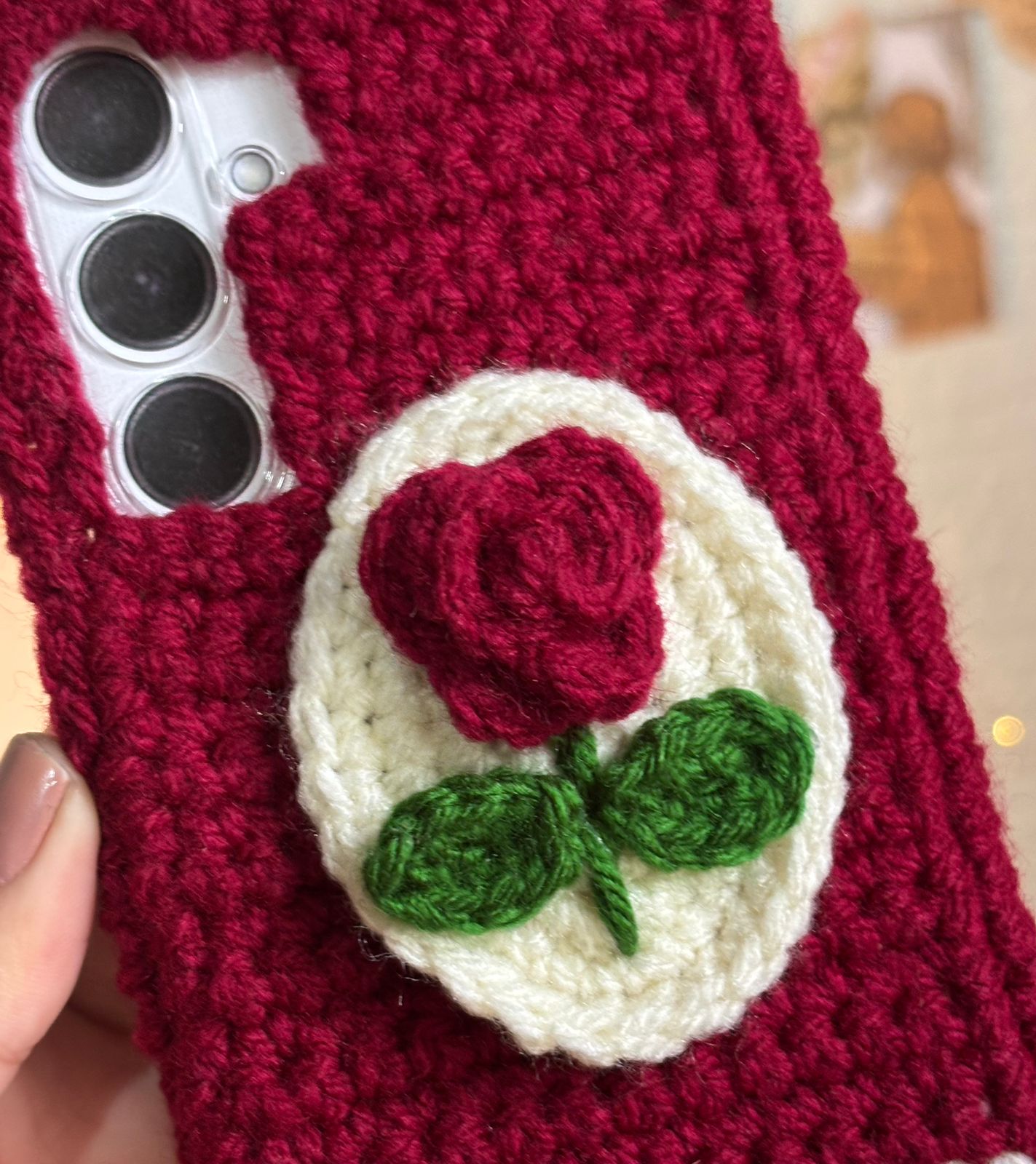 Handmade maroon crochet phone case with rose flower wool aesthetic design