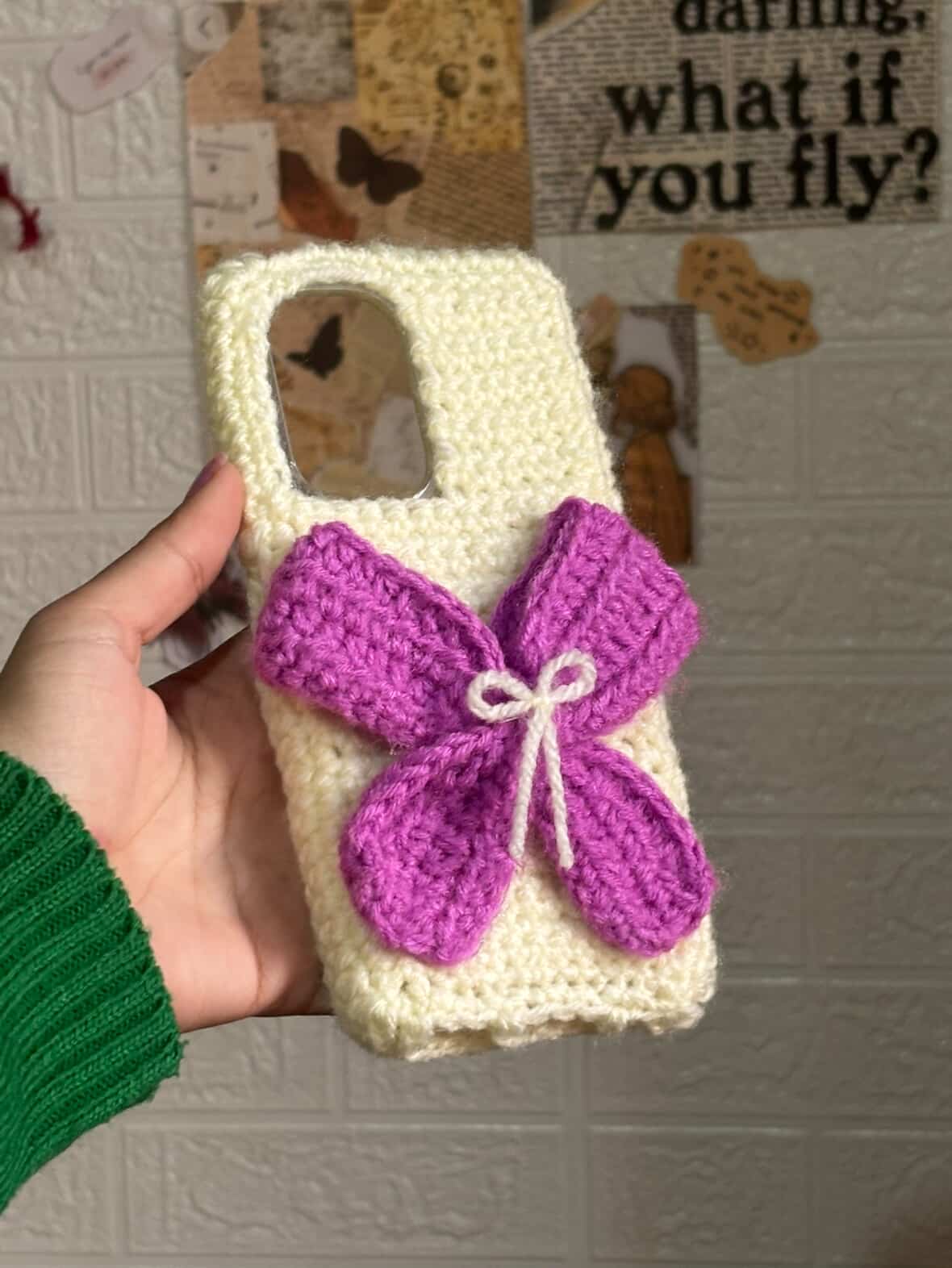 Handmade crochet bow phone case with soft yarn aesthetic design for iPhone and Android