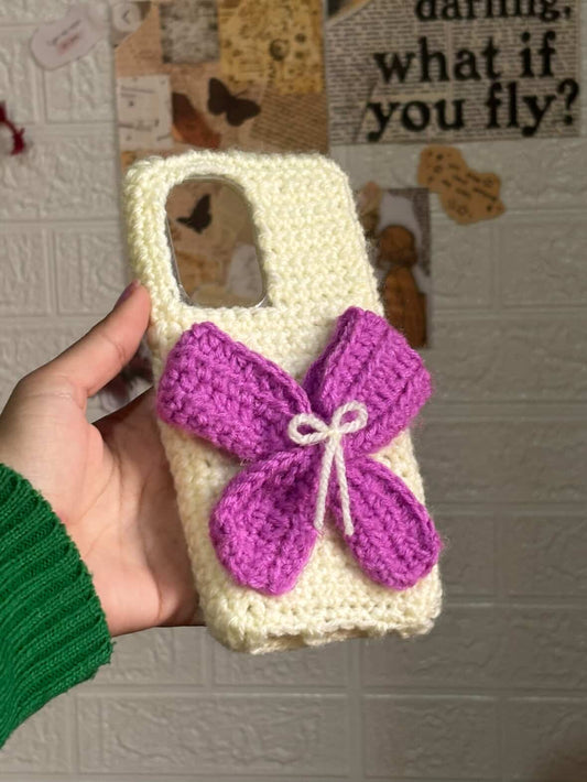 Handmade crochet bow phone case with soft yarn aesthetic design for iPhone and Android