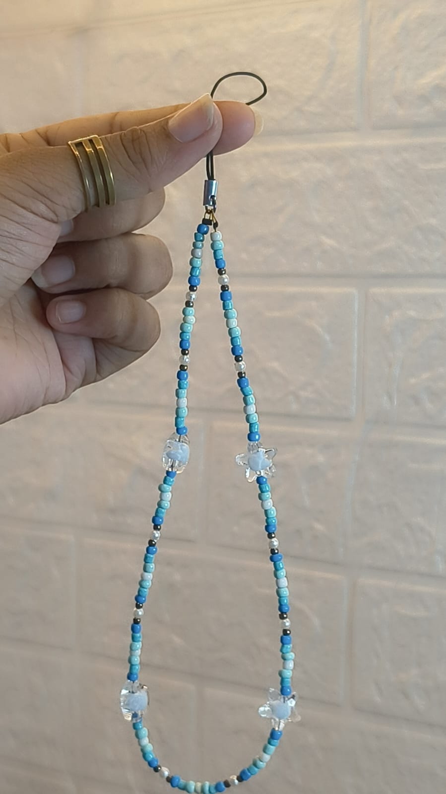 Handmade Blue Crystal Beaded Phone Charm Strap featuring blue and white seed beads with sparkling crystal accent beads, compatible with iPhone, Samsung and all smartphones.