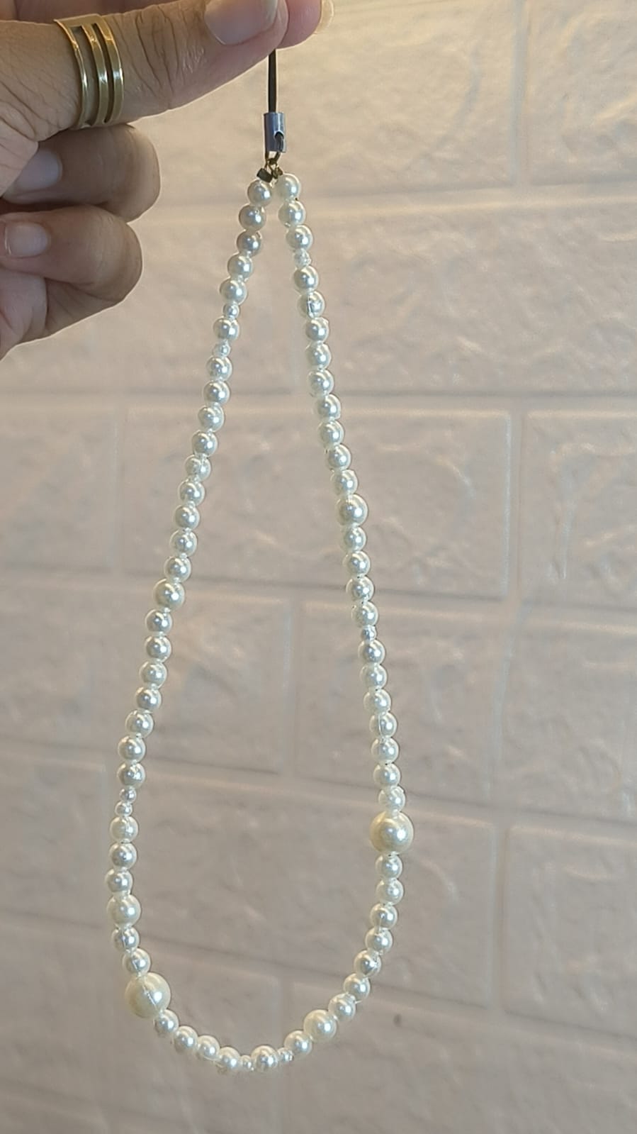 Classic handmade pearl beaded phone charm strap with glossy white pearl beads, elegant mobile wrist strap compatible with iPhone, Samsung and all smartphones.