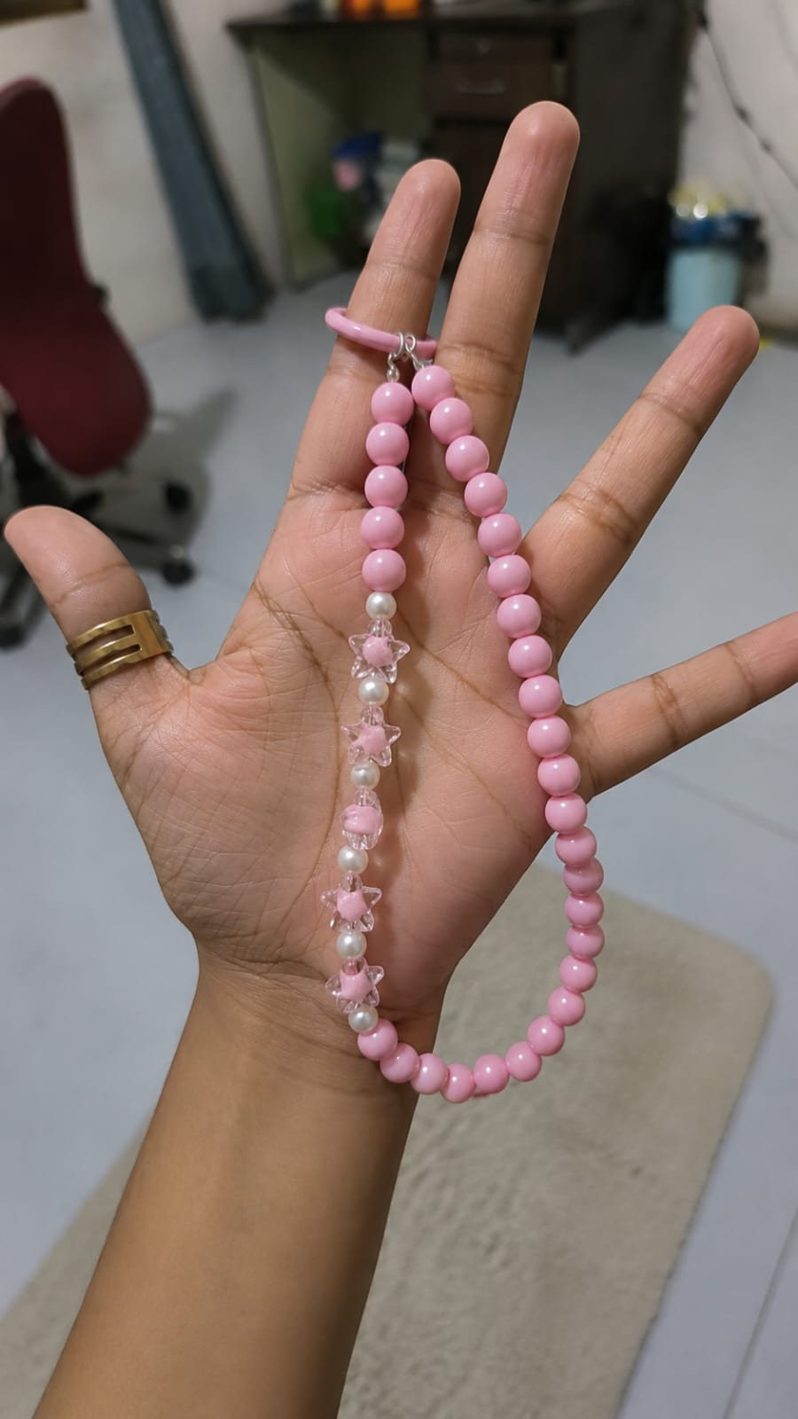 Pink star beaded phone charm strap with glossy pink beads, pearl accents and transparent star charms for iPhone and Android smartphones