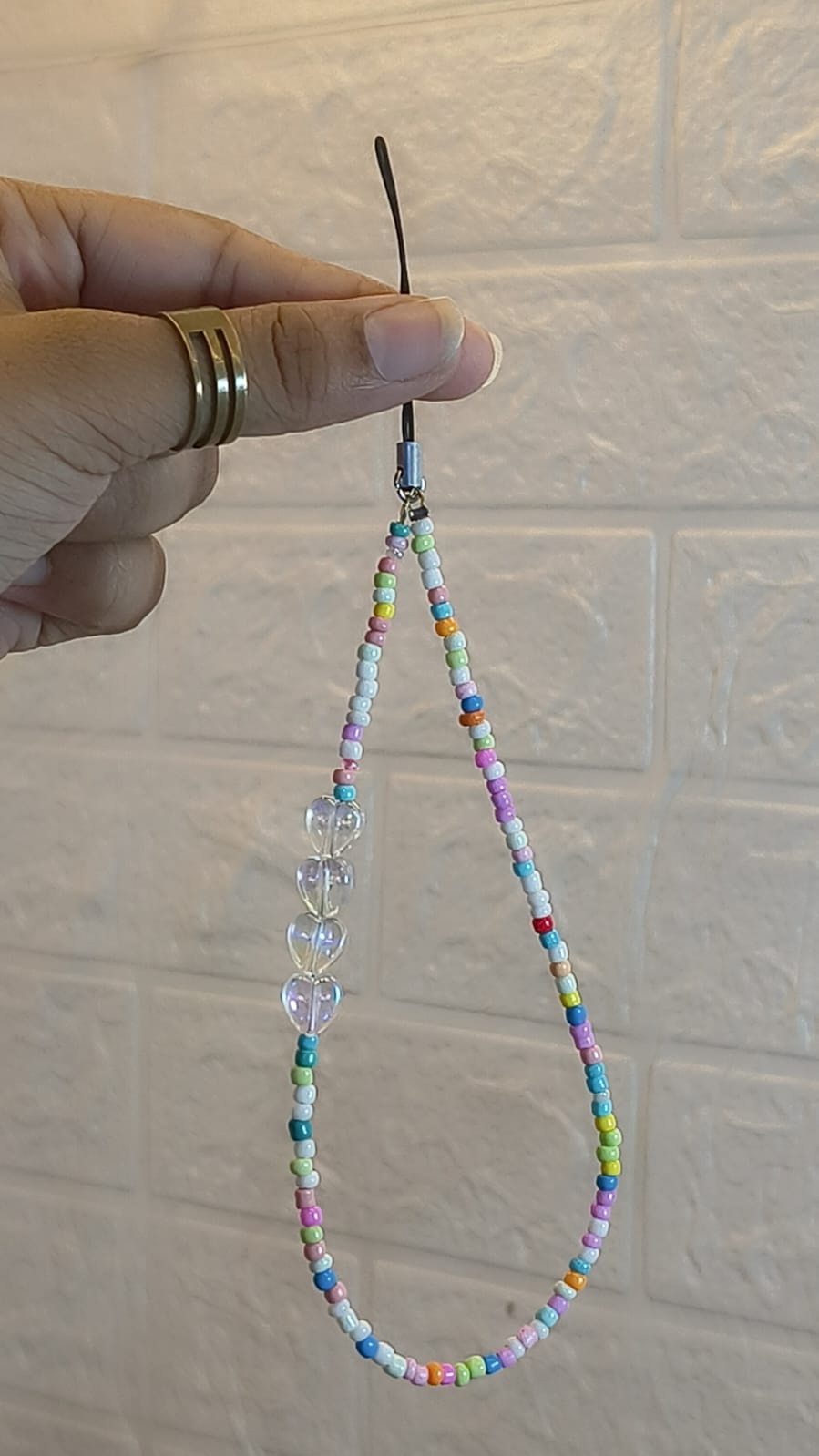 Handmade rainbow heart beaded phone charm strap with colorful beads and transparent heart charms for smartphones, handbags and keys.